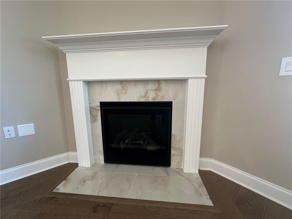 1001 Calypso Way, Unit 1001 Cumming, GA 30040 - Photo 9 of 27 a living room with a fireplace