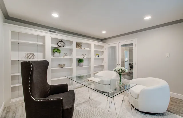 a living room with furniture and a table