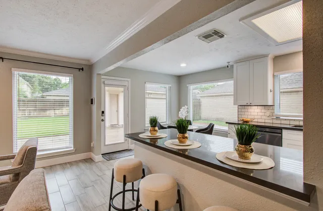a dining room with furniture window and outside view