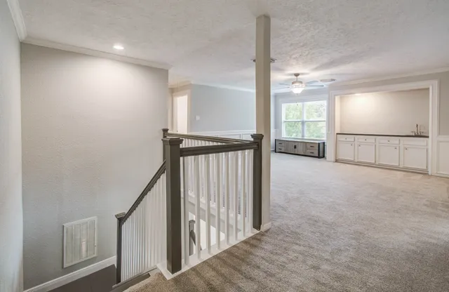 a view of hallway with stairs