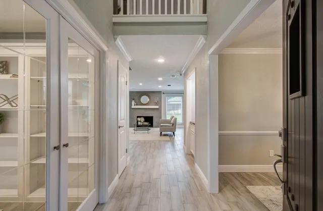 a view of a hallway view with wooden floor and staircase