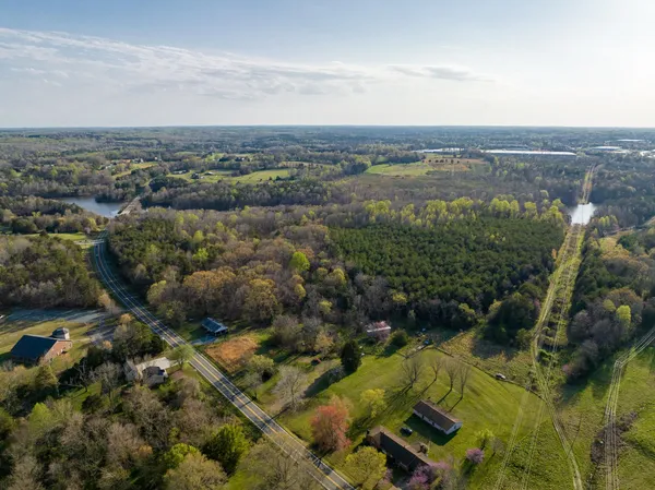 an aerial view of residential building and lake