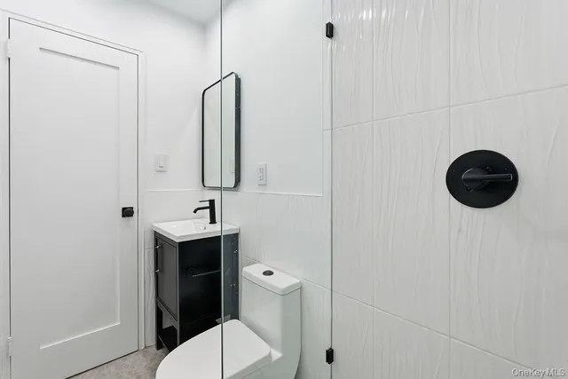 a bathroom with a toilet and a sink