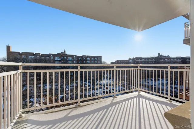 a view of balcony with wooden floor