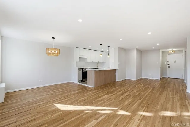 a view of kitchen and empty room