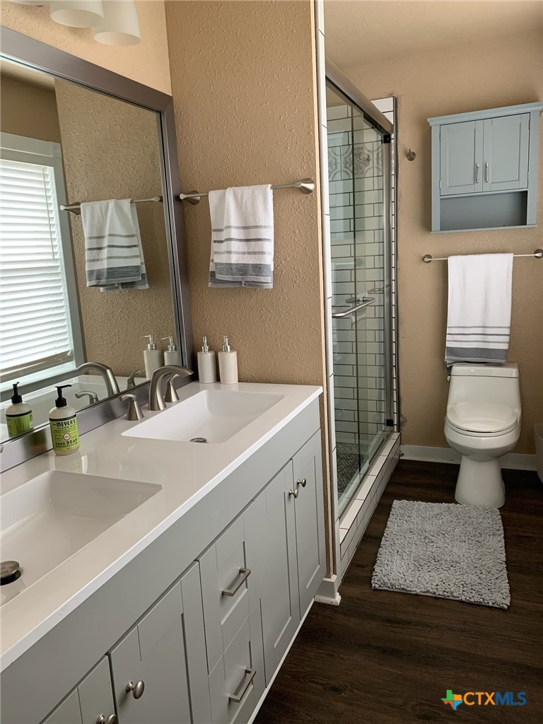 952 Fannin Loop Temple, TX 76501 - Photo 16 of 17 a bathroom with a sink a toilet and shower