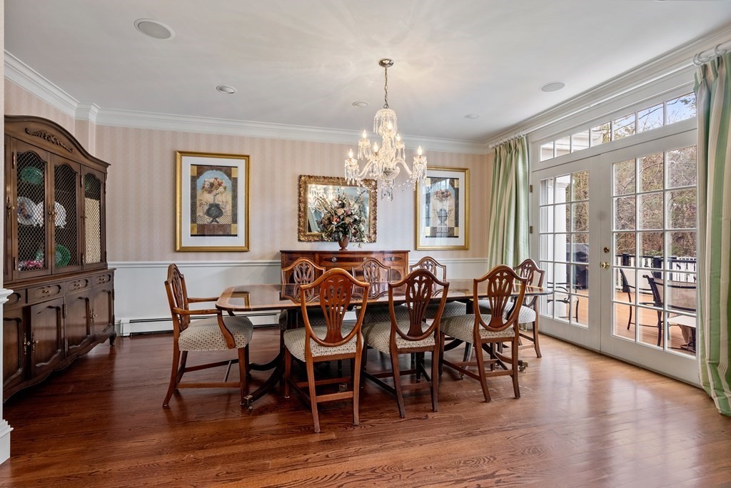 26 Robin Road Weston, MA 02493 - Photo 17 of 42 a view of a dining room with furniture window and wooden floor