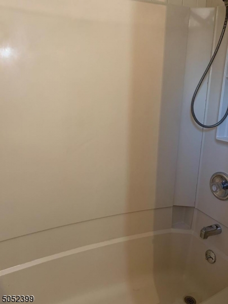 31 Morgan Lane, Unit 2A Bridgewater, NJ 08807 - Photo 11 of 12 a bathroom with a bath tub and a shower