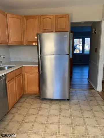a white refrigerator freezer sitting in a kitchen