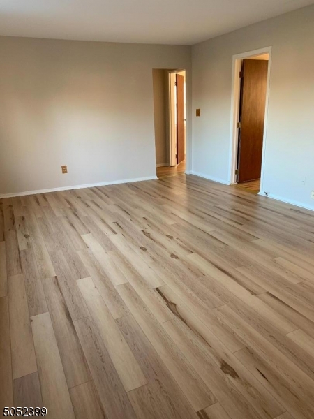 31 Morgan Lane, Unit 2A Bridgewater, NJ 08807 - Photo 7 of 12 wooden floor in an empty room