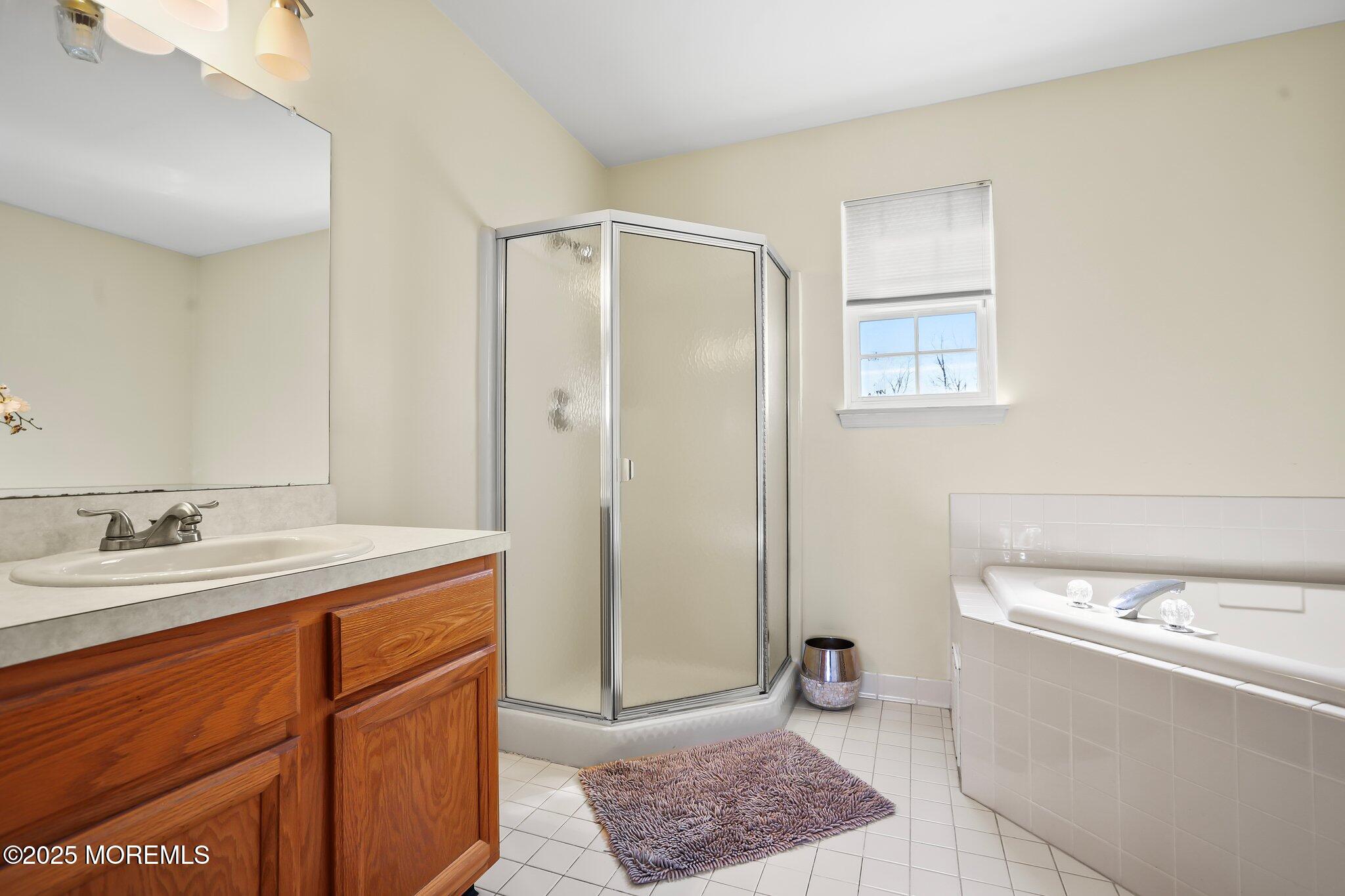 21 Sun Hollow Road Howell, NJ 07731 - Photo 30 of 47 a bathroom with a granite countertop sink and a mirror
