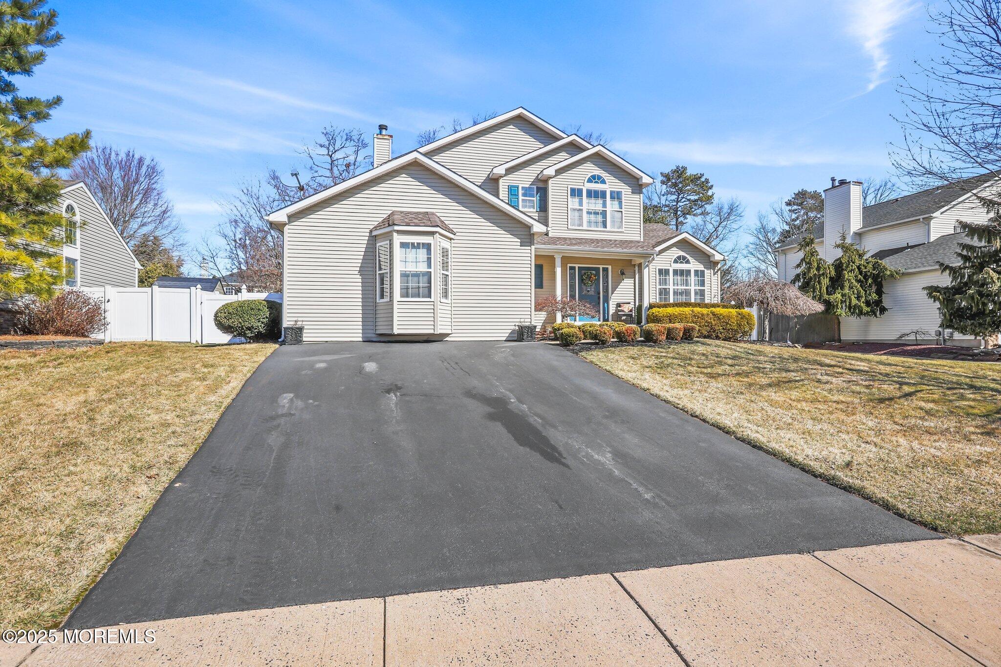 21 Sun Hollow Road Howell, NJ 07731 - Photo 4 of 47 a front view of a house with a yard