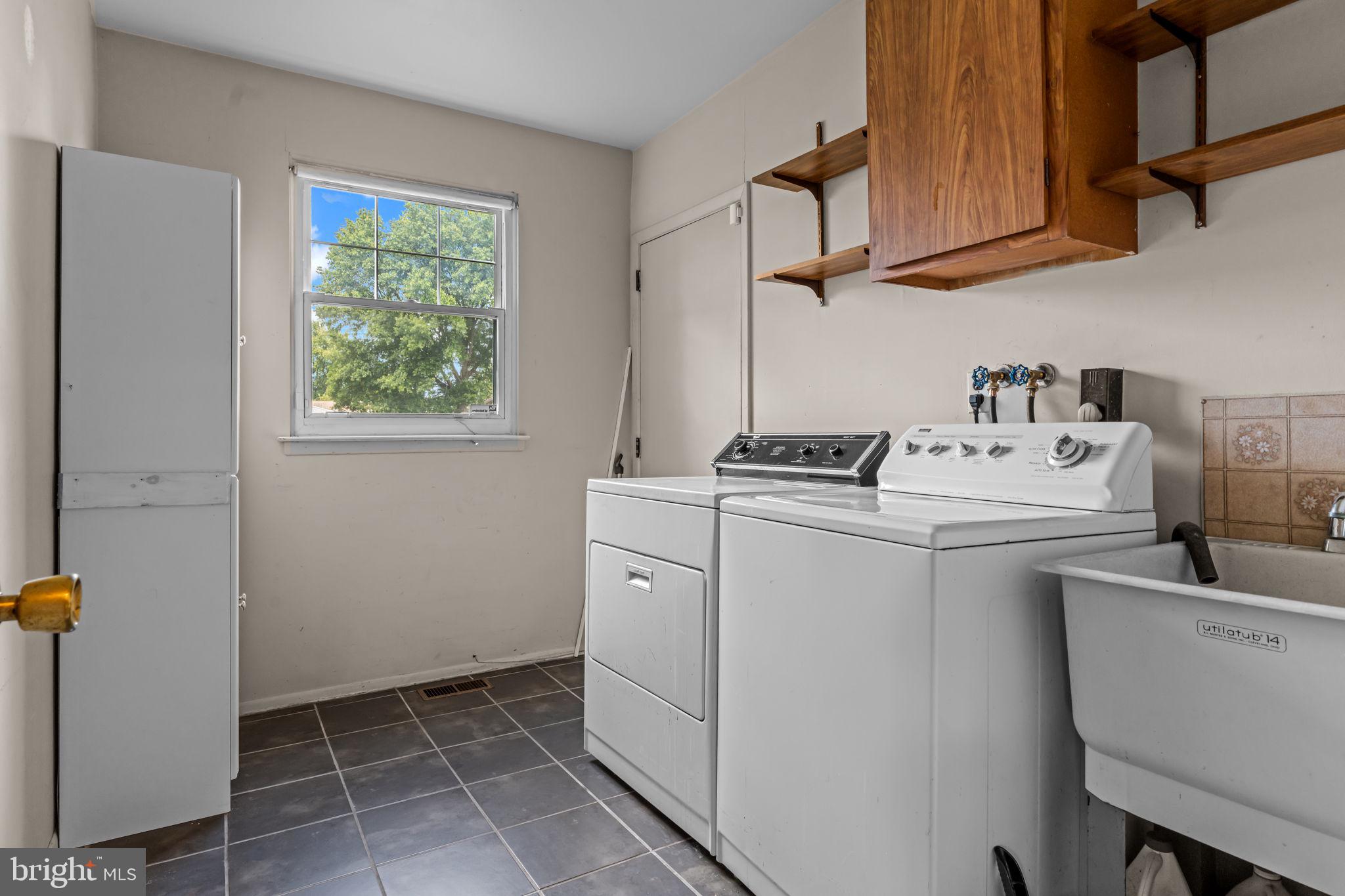 110 Linda Avenue Delran, NJ 08075 - Photo 11 of 26 a utility room with cabinets washer and dryer