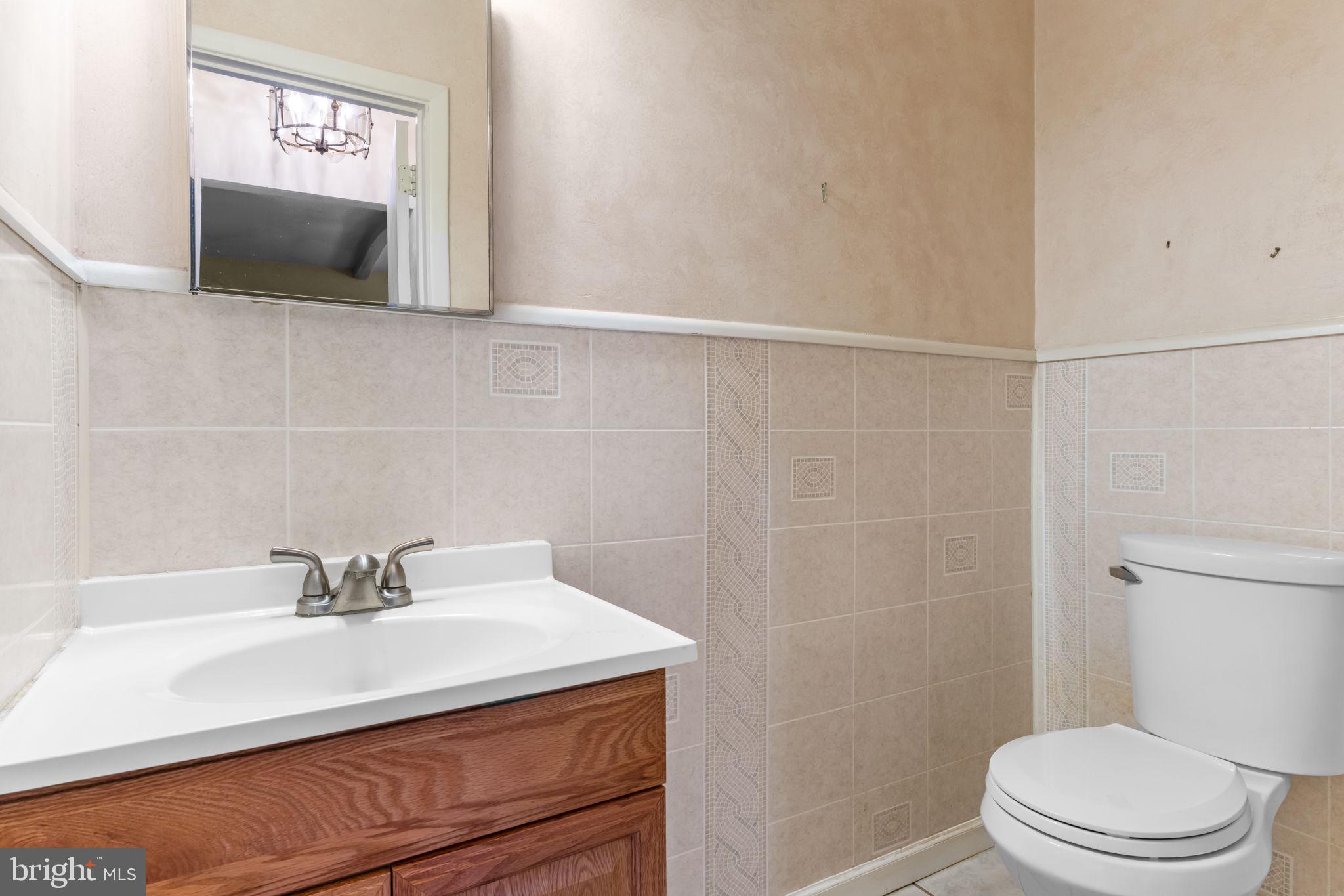 110 Linda Avenue Delran, NJ 08075 - Photo 12 of 26 a bathroom with a sink a toilet and mirror