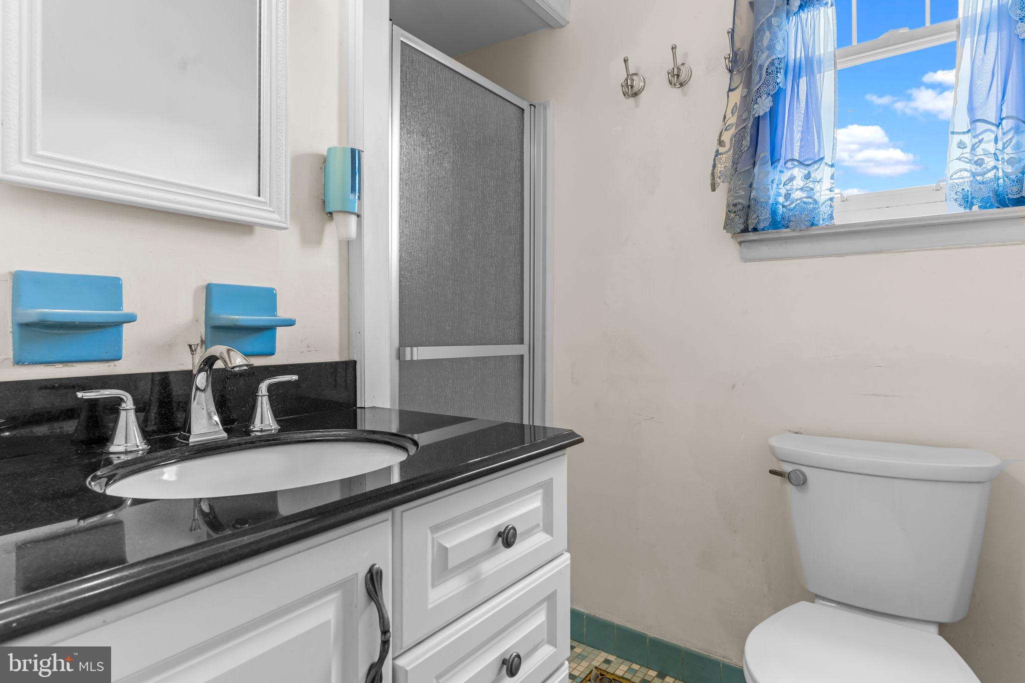 110 Linda Avenue Delran, NJ 08075 - Photo 15 of 26 a bathroom with a granite countertop toilet sink and mirror