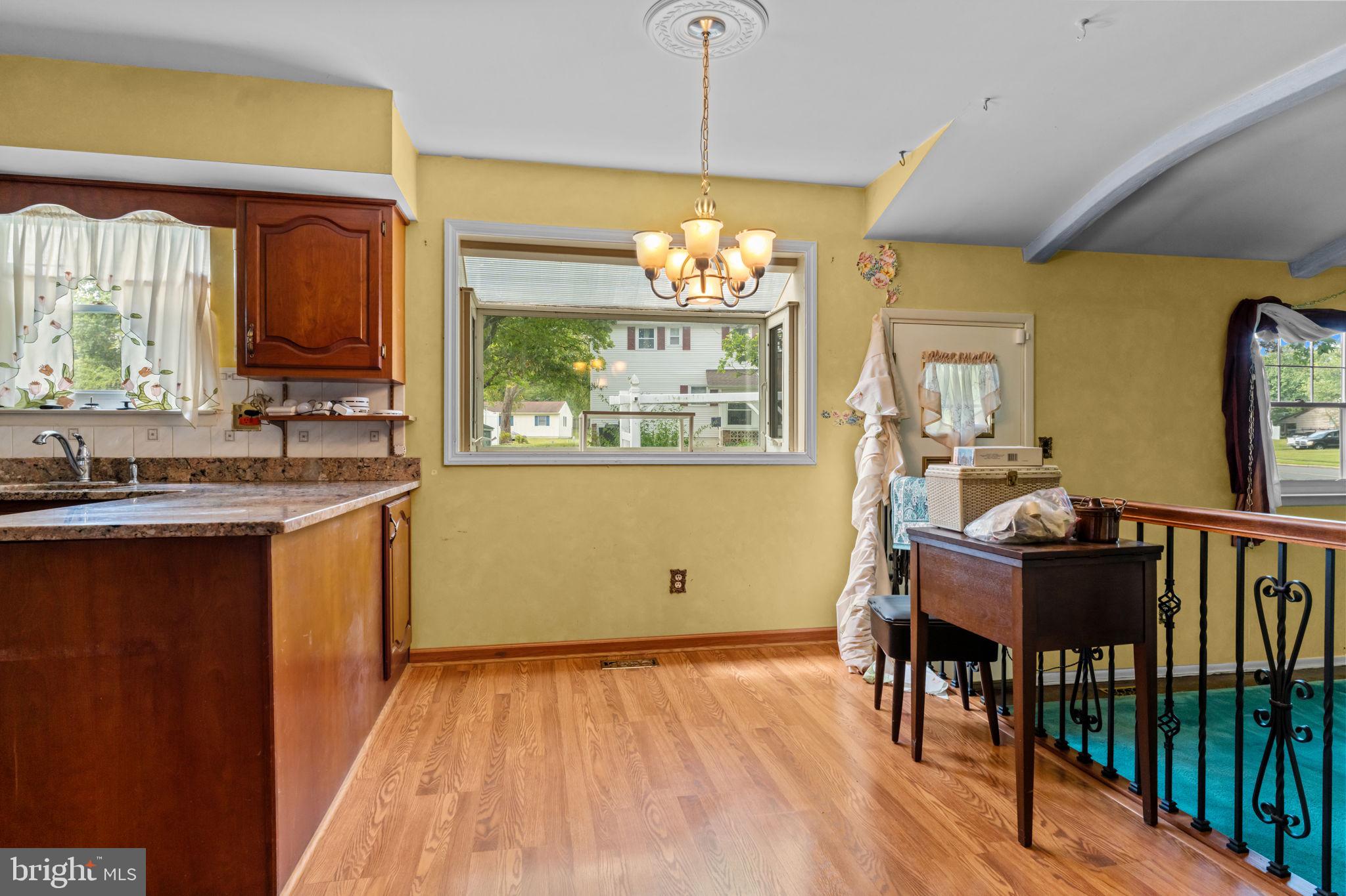 110 Linda Avenue Delran, NJ 08075 - Photo 7 of 26 a view of a kitchen with furniture window and wooden floor