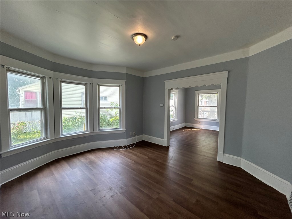 3403 Fulton Road, Unit DOWN Cleveland, OH 44109 - Photo 5 of 18 Spare room featuring dark hardwood / wood-style floors