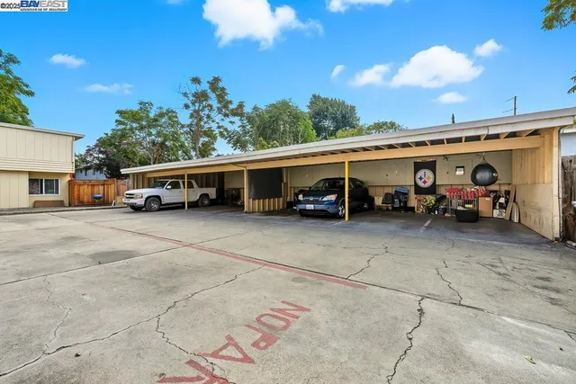 a view of street with parked cars