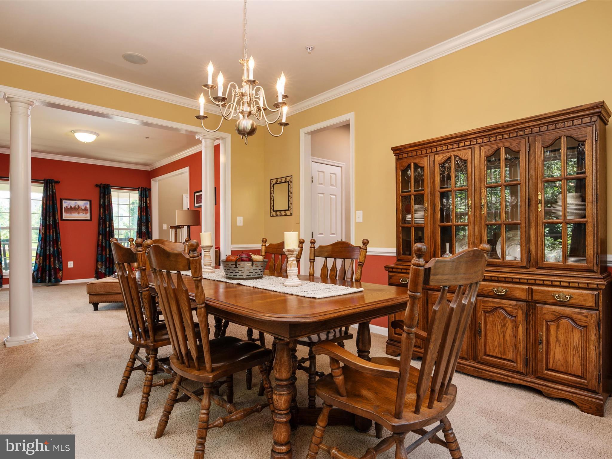 10518 Windlass Run Road Baltimore, MD 21220 - Photo 15 of 71 a view of a dining room with furniture and chandelier