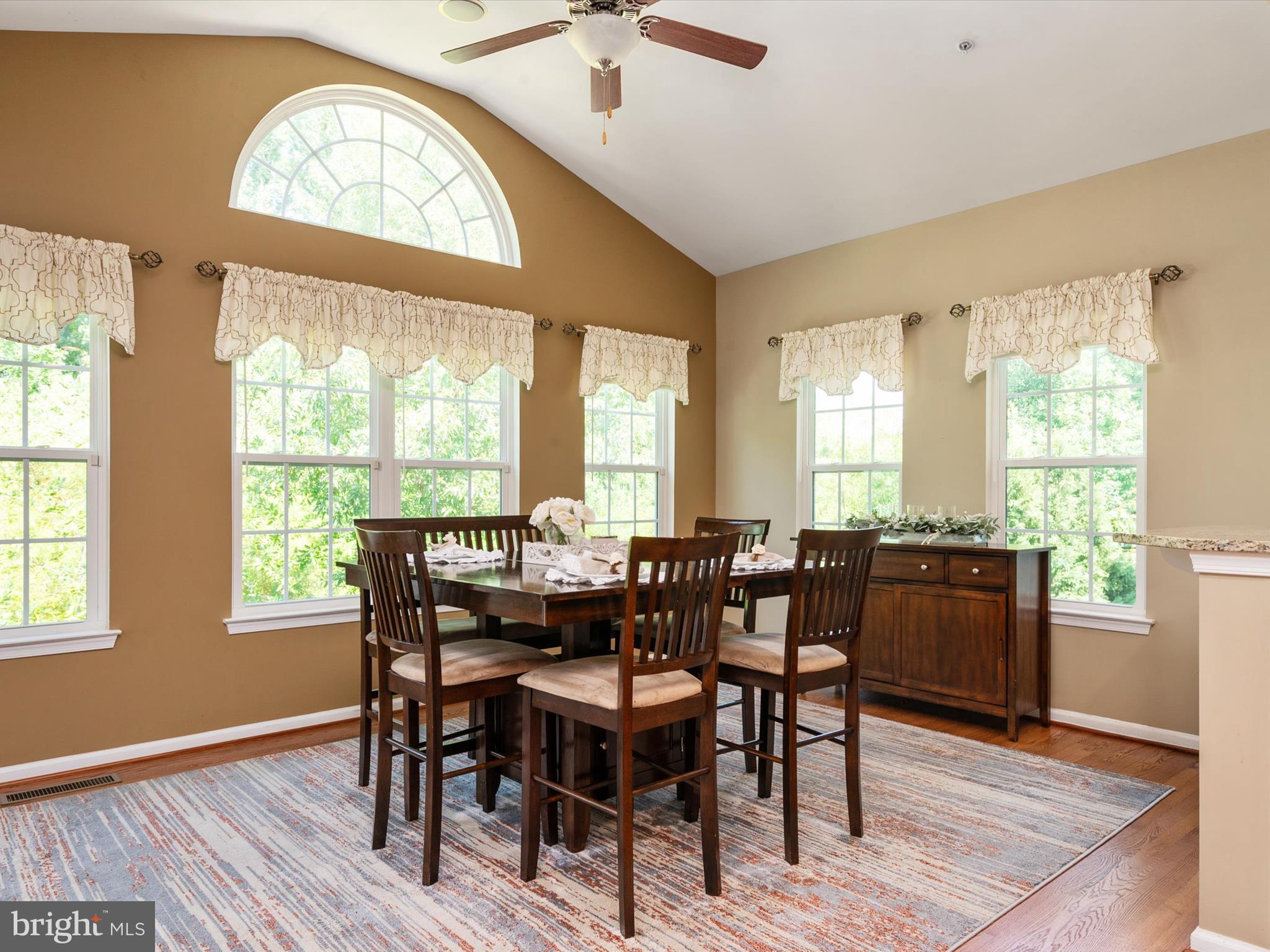 10518 Windlass Run Road Baltimore, MD 21220 - Photo 20 of 71 a view of a dining room with furniture window and wooden floor