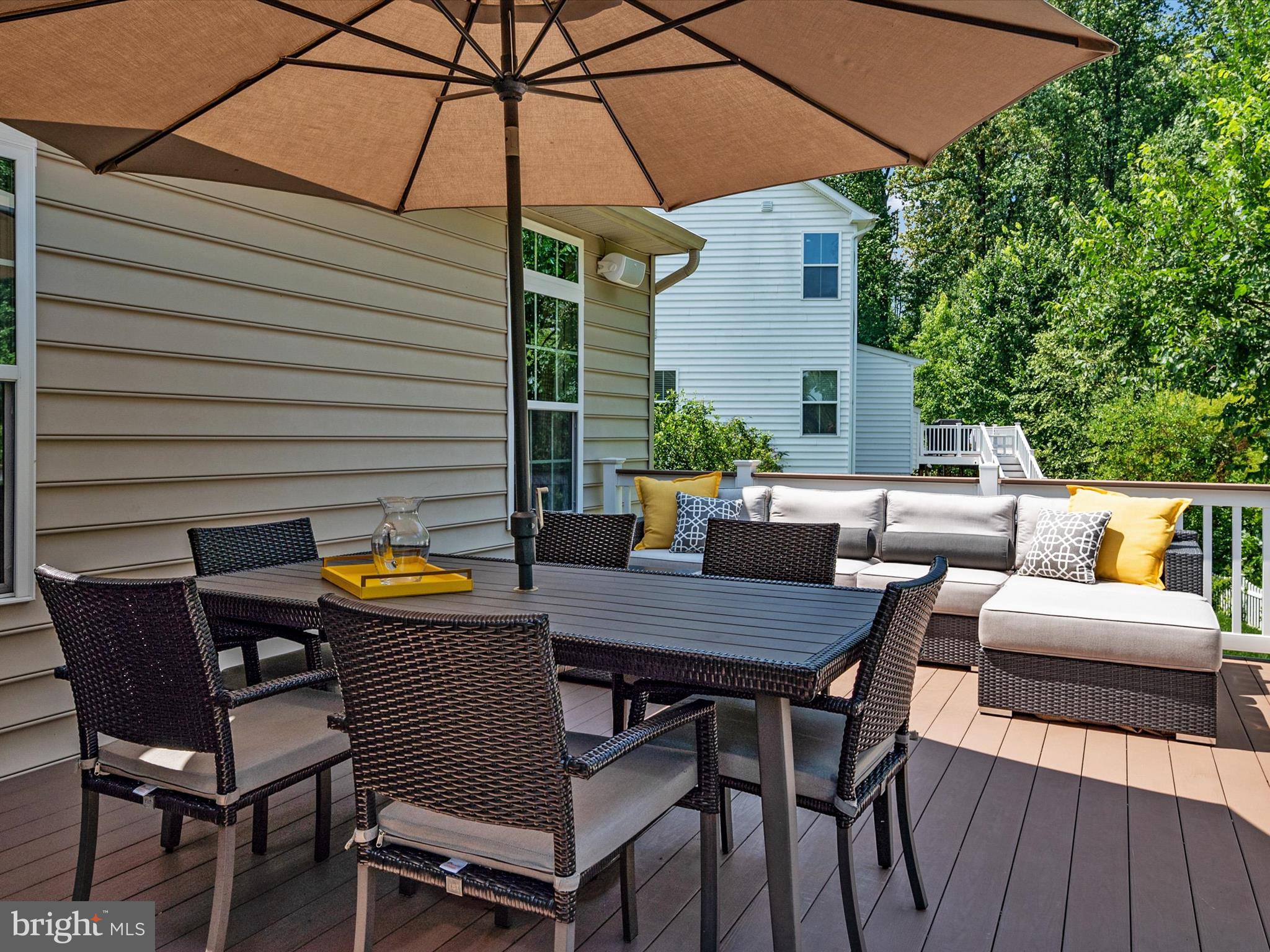 10518 Windlass Run Road Baltimore, MD 21220 - Photo 22 of 71 a view of a patio with table and chairs under an umbrella