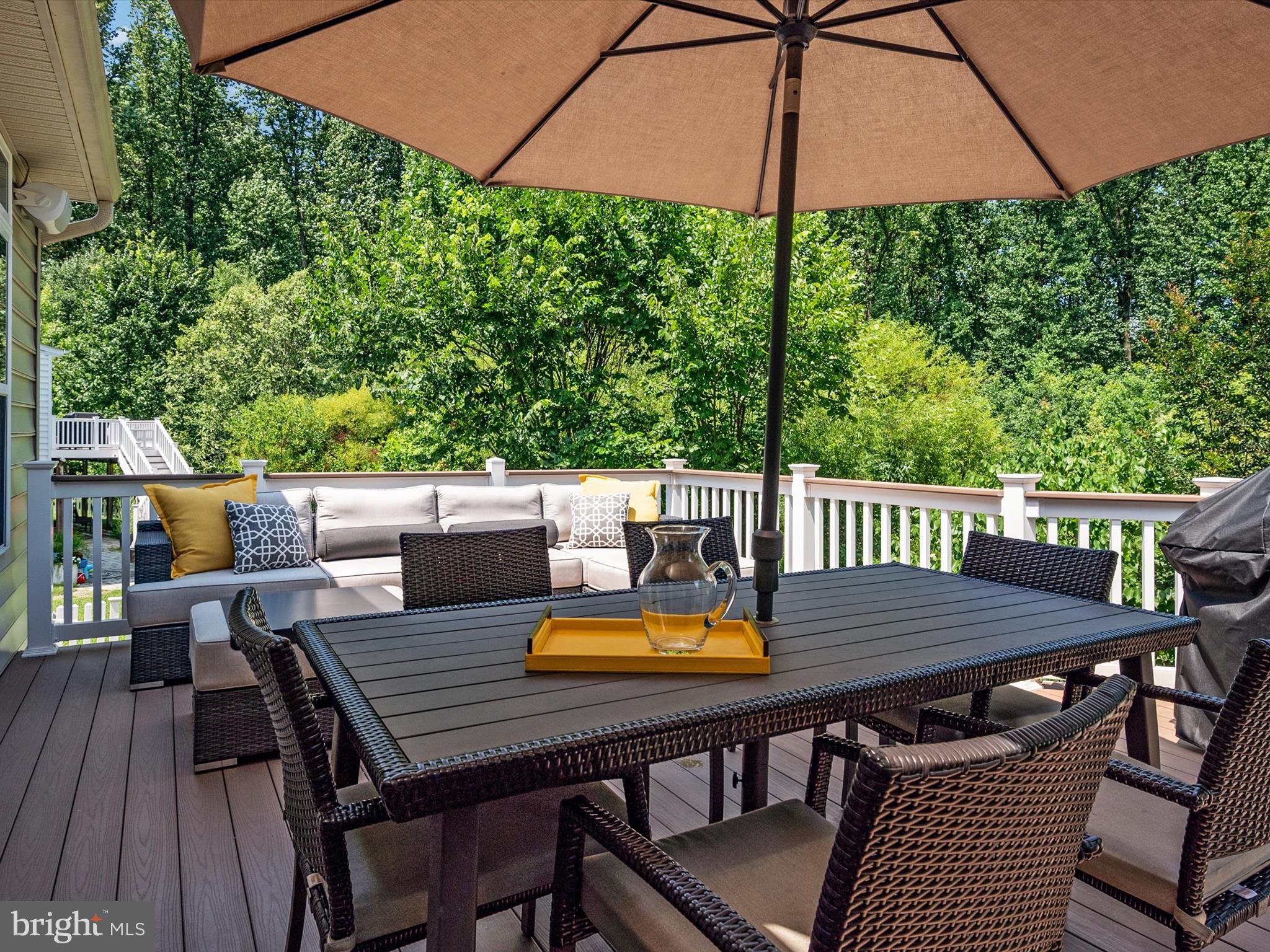 10518 Windlass Run Road Baltimore, MD 21220 - Photo 23 of 71 a view of a dining table and chairs on the roof deck
