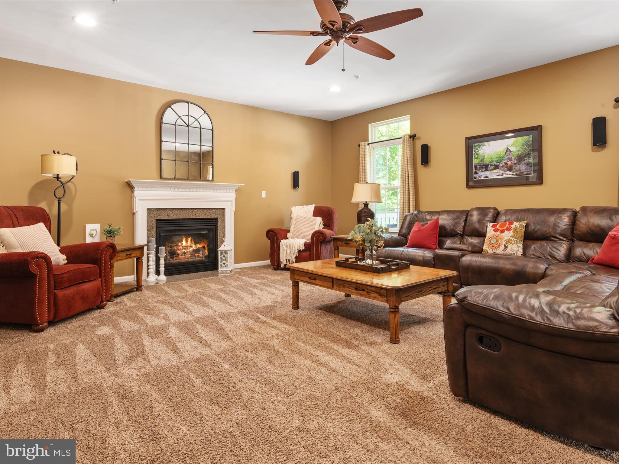 10518 Windlass Run Road Baltimore, MD 21220 - Photo 29 of 71 a living room with furniture and a fireplace