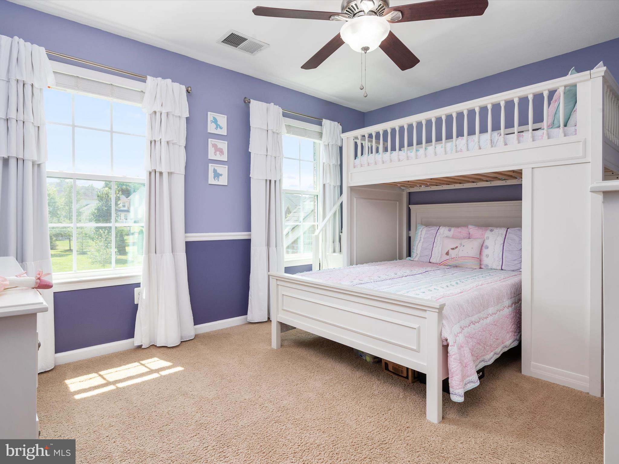 10518 Windlass Run Road Baltimore, MD 21220 - Photo 41 of 71 a bedroom with a large bed and a chandelier fan