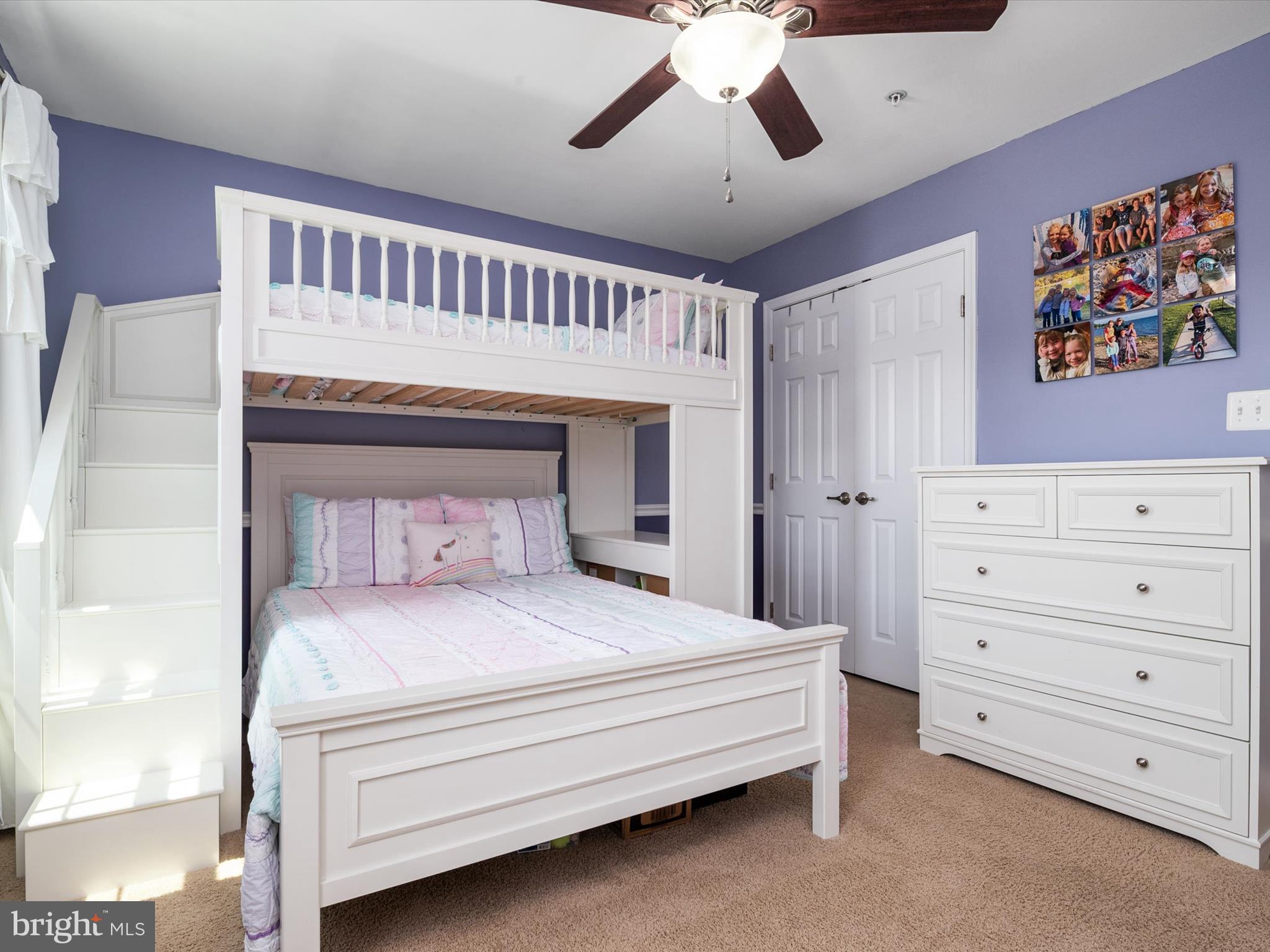 10518 Windlass Run Road Baltimore, MD 21220 - Photo 42 of 71 a bedroom with a large bed and a chandelier