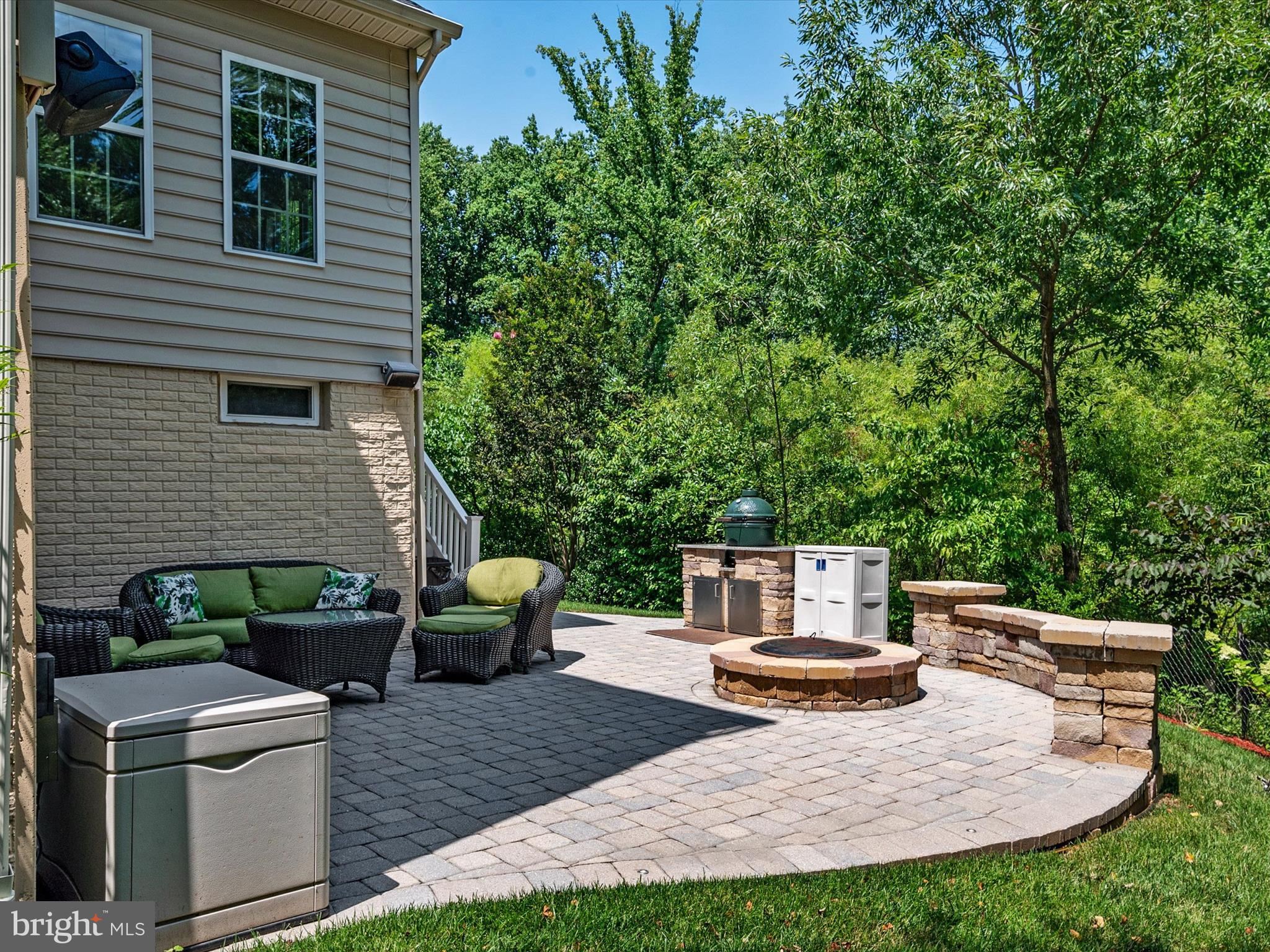 10518 Windlass Run Road Baltimore, MD 21220 - Photo 59 of 71 a view of a backyard with table and chairs potted plants and large tree