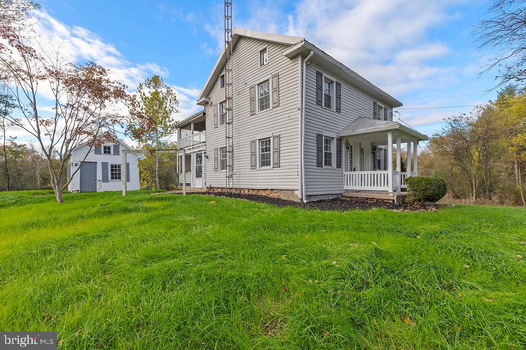 2860 Mayberry Road Taneytown, MD 21787 - Photo 16 of 31 a front view of a house with a garden