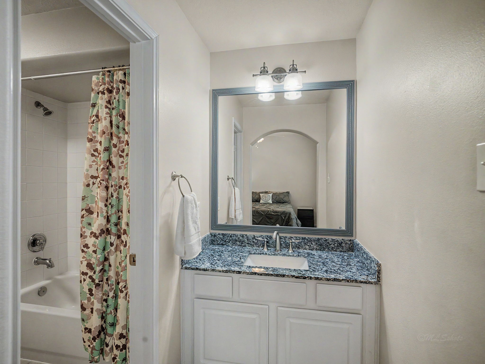 2210 Fox Path Katy, TX 77494 - Photo 33 of 47 The bathing area is thoughtfully arranged with a clean white tile surround tub-and-shower combination, maximizing functionality for a busy household.