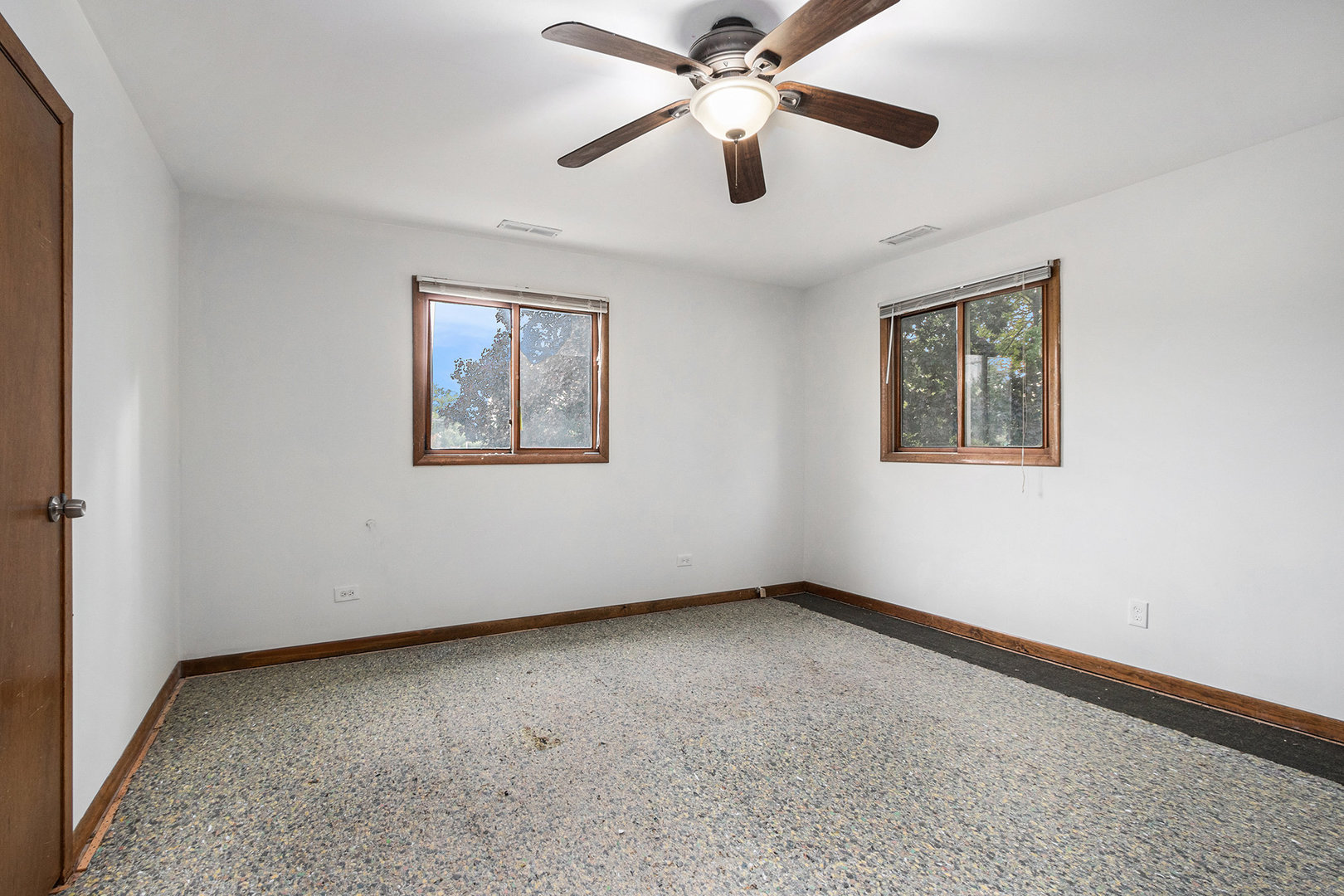 17153 Burnham Avenue Lansing, IL 60438 - Photo 8 of 18 an empty room with a window and a fan
