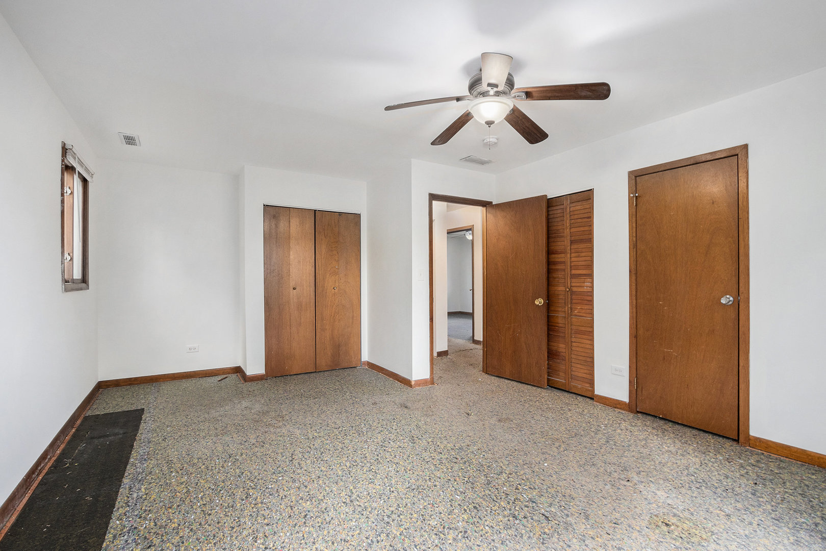 17153 Burnham Avenue Lansing, IL 60438 - Photo 9 of 18 a view of empty room with ceiling fan