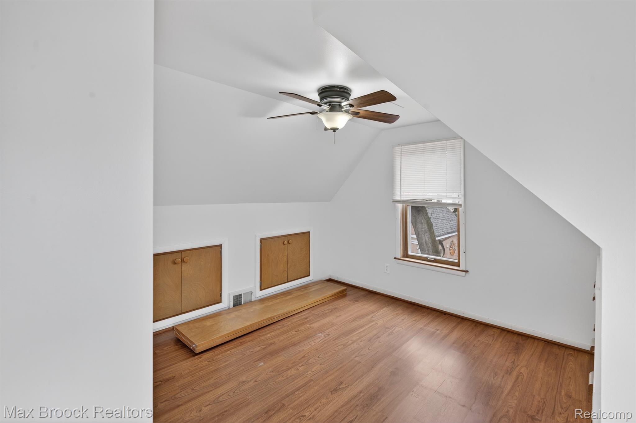 9024 Mandon Road White Lake, MI 48386 - Photo 21 of 39 Additional living space featuring a ceiling fan, lofted ceiling, and light wood finished floors