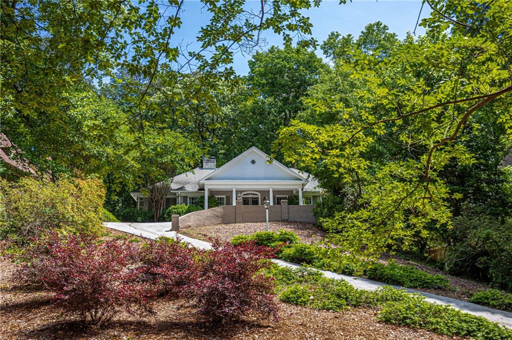 4765 Paran Valley Northwest Atlanta, GA 30327 - Photo 1 of 61 a front view of a house with a yard
