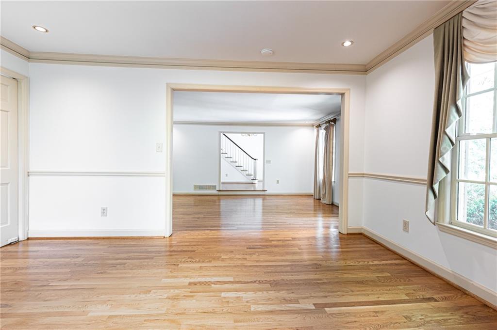 4765 Paran Valley Northwest Atlanta, GA 30327 - Photo 15 of 61 a view of empty room with wooden floor and fan