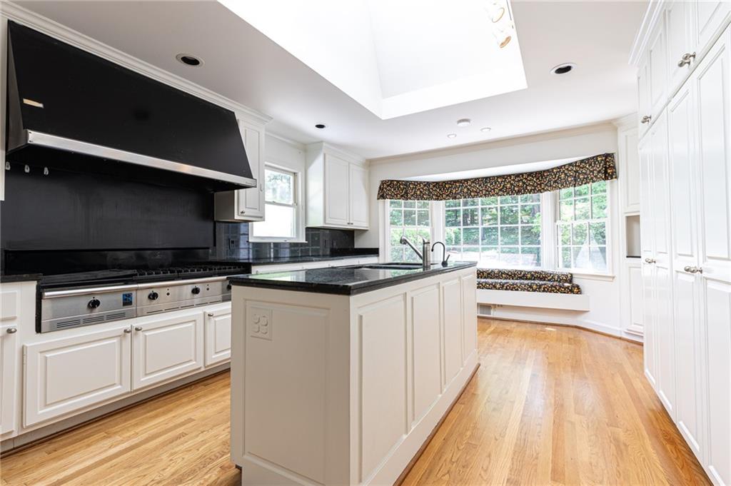 4765 Paran Valley Northwest Atlanta, GA 30327 - Photo 23 of 61 a kitchen with stainless steel appliances a stove sink and microwave