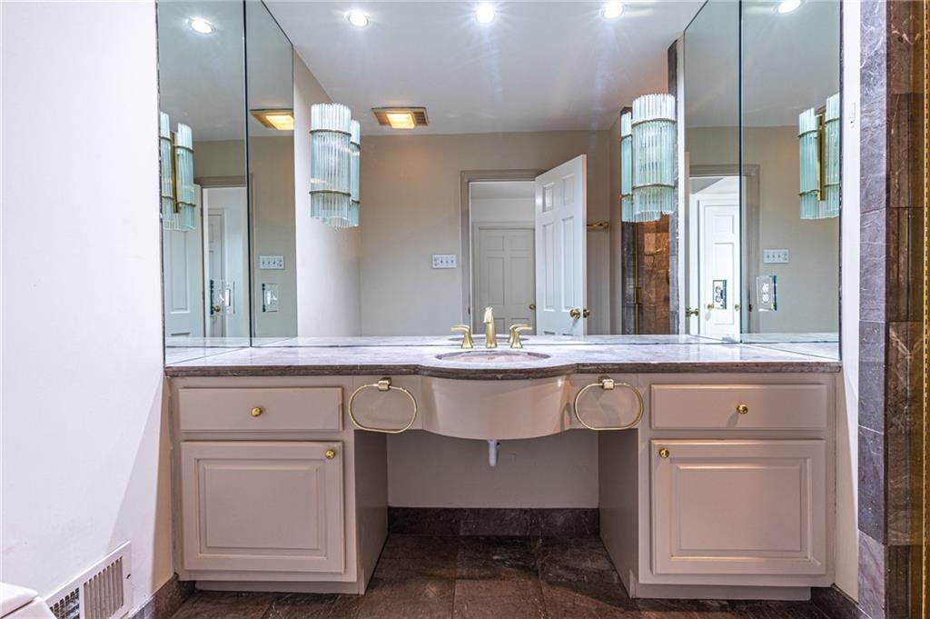 4765 Paran Valley Northwest Atlanta, GA 30327 - Photo 27 of 61 a bathroom with a sink and a mirror