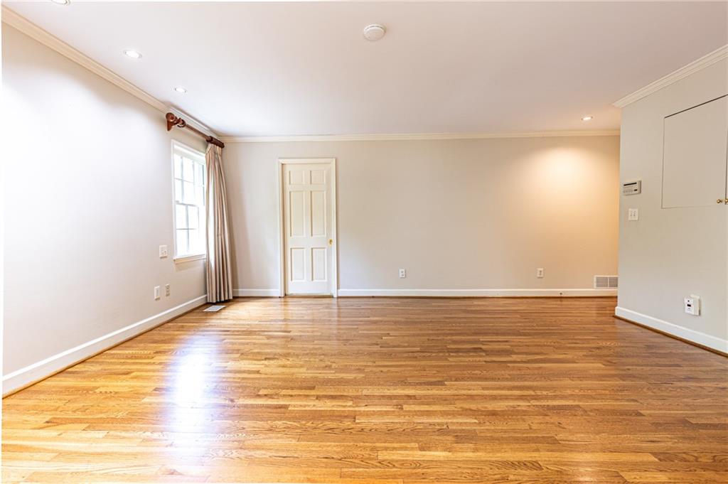 4765 Paran Valley Northwest Atlanta, GA 30327 - Photo 31 of 61 a view of an empty room with wooden floor and a window
