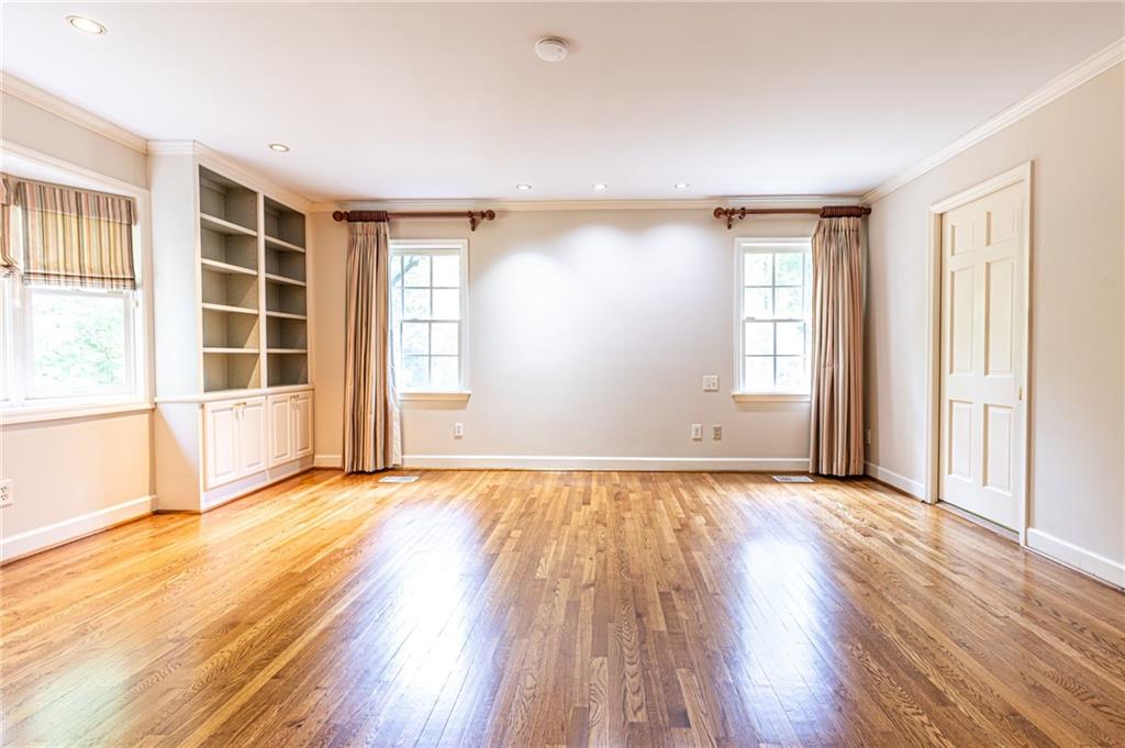 4765 Paran Valley Northwest Atlanta, GA 30327 - Photo 33 of 61 an empty room with wooden floor and windows