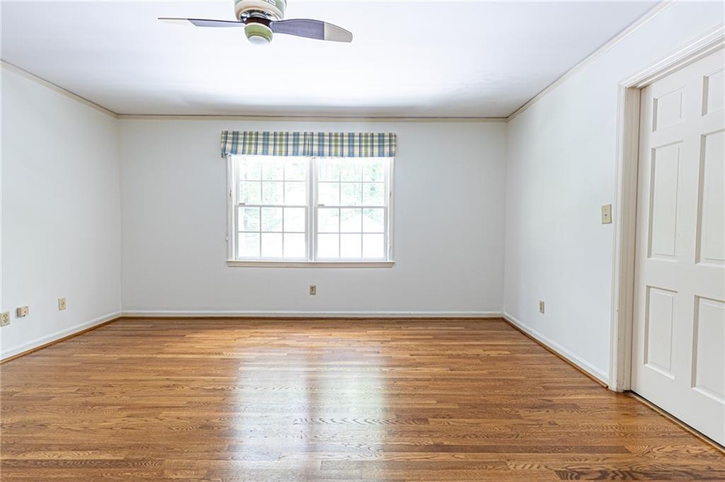 4765 Paran Valley Northwest Atlanta, GA 30327 - Photo 44 of 61 wooden floor in an empty room with a window