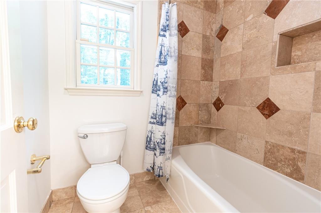 4765 Paran Valley Northwest Atlanta, GA 30327 - Photo 46 of 61 a white toilet sitting next to a bath tub