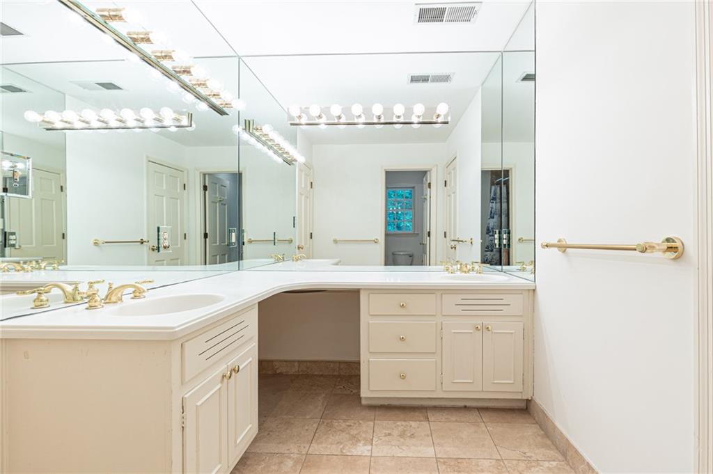 4765 Paran Valley Northwest Atlanta, GA 30327 - Photo 47 of 61 a spacious bathroom with a sink a large mirror and a shower
