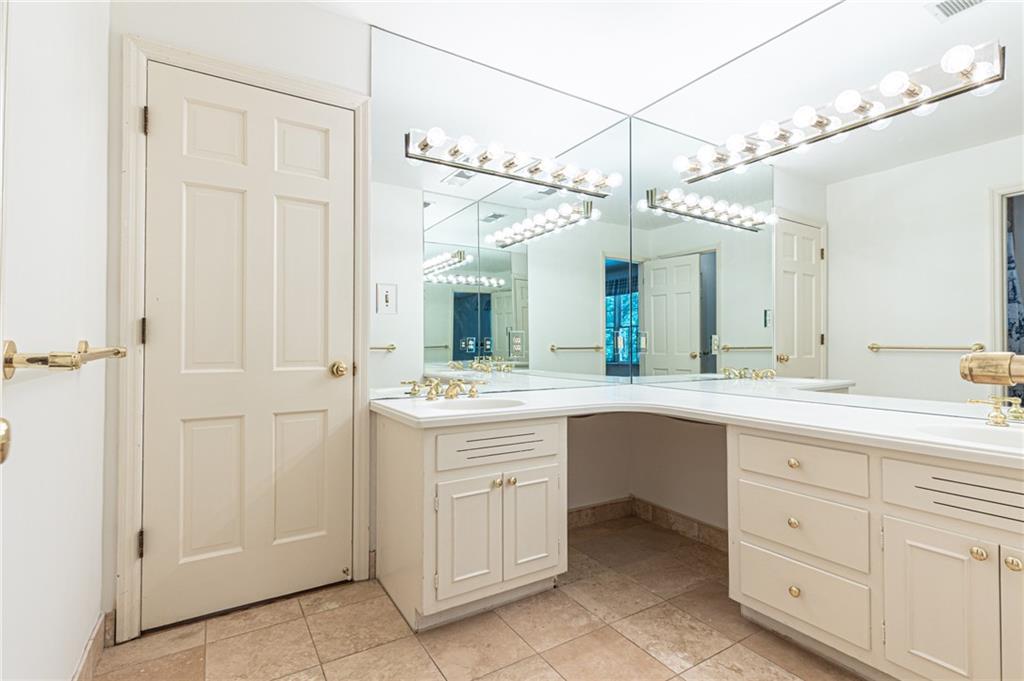 4765 Paran Valley Northwest Atlanta, GA 30327 - Photo 48 of 61 a spacious bathroom with a double vanity sink and a mirror