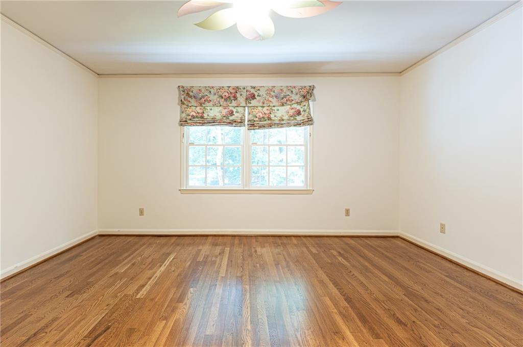 4765 Paran Valley Northwest Atlanta, GA 30327 - Photo 50 of 61 an empty room with wooden floor and windows