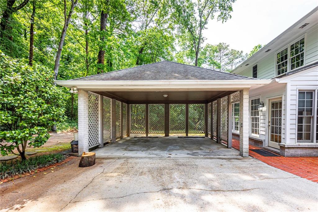 4765 Paran Valley Northwest Atlanta, GA 30327 - Photo 51 of 61 a backyard of a house with large trees and barbeque oven