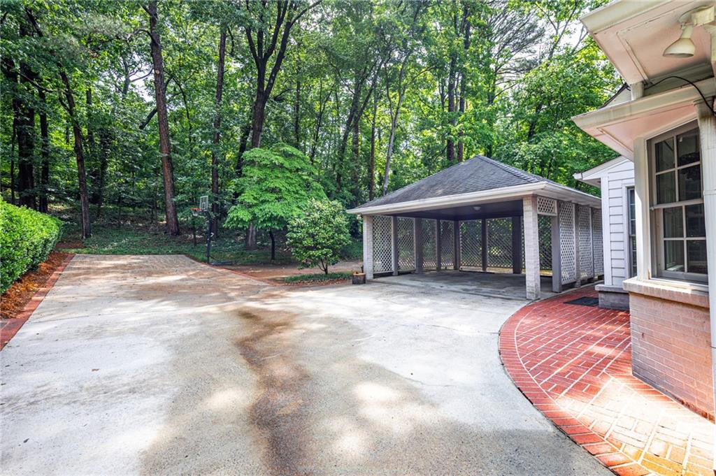 4765 Paran Valley Northwest Atlanta, GA 30327 - Photo 52 of 61 a front view of a house with yard outdoor seating and green space