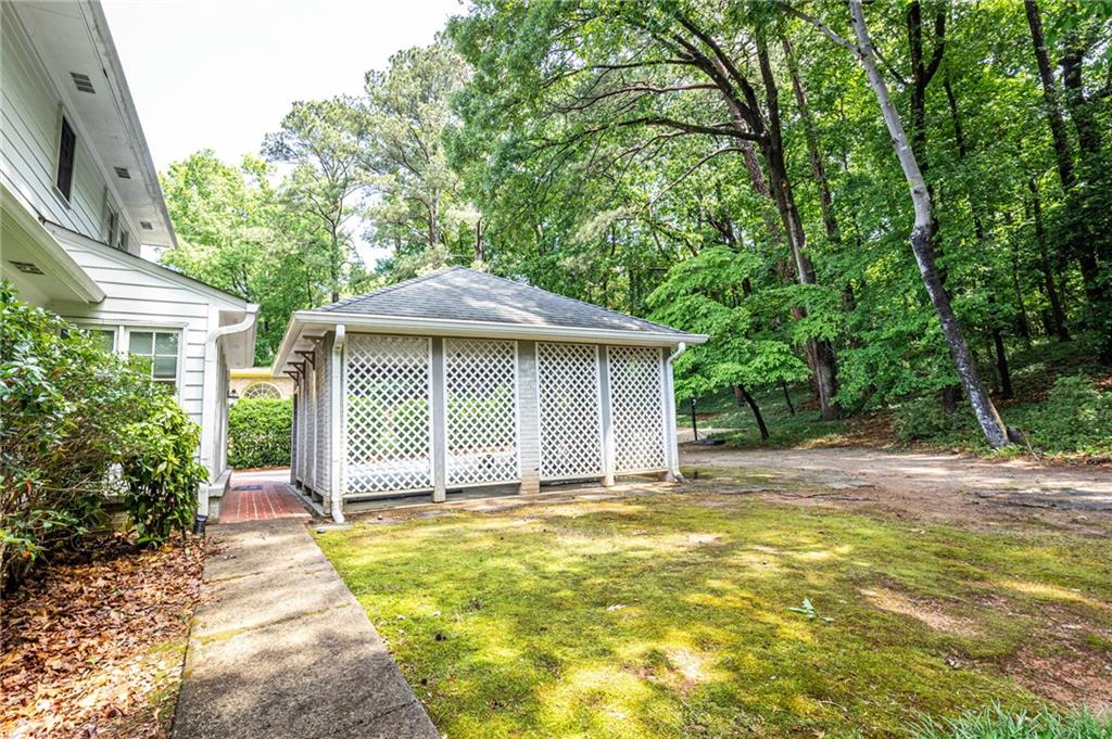 4765 Paran Valley Northwest Atlanta, GA 30327 - Photo 53 of 61 a front view of a house with a garden