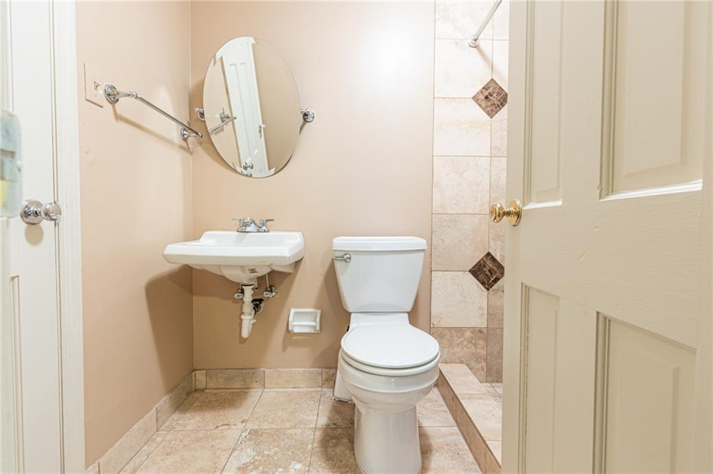 4765 Paran Valley Northwest Atlanta, GA 30327 - Photo 60 of 61 a bathroom with a toilet sink and mirror